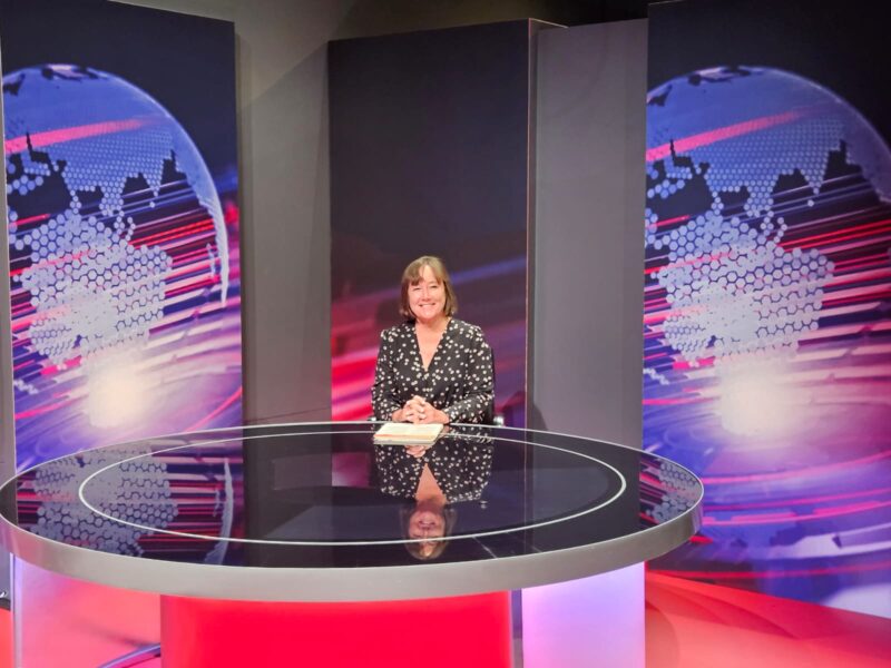 Sat behind the BBC News Desk
